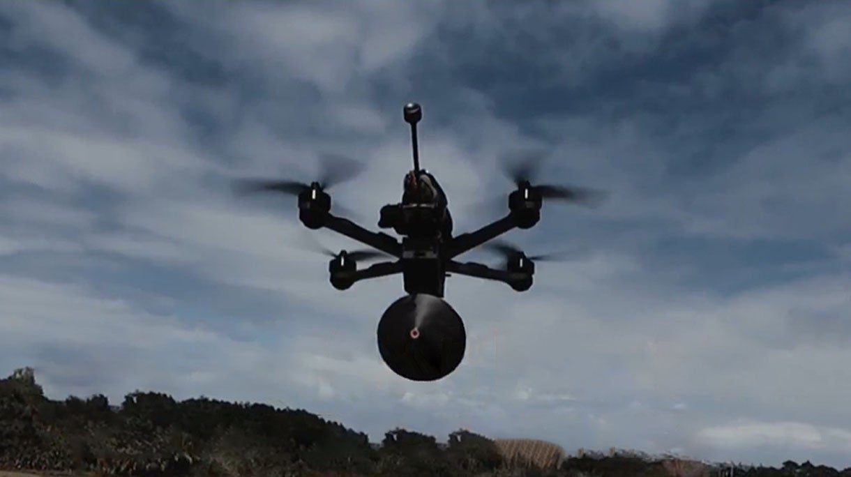 Flying drone with fiber-optic-tether